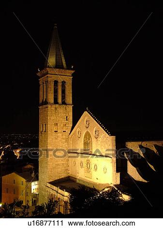 Stock Image -  Spoleto, Italy, Umbria, Europe, The cathedral is illuminated at night in the medieval city of Spoleto.. Fotosearch