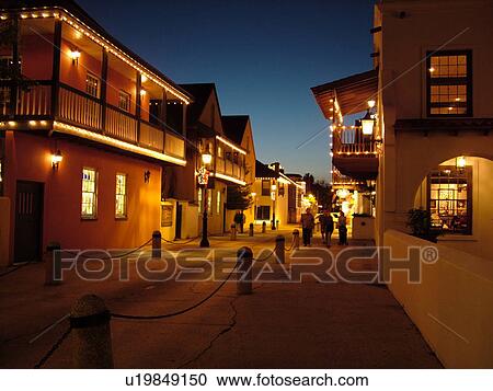 Stock Image -  St. Augustine, FL, Florida, The Old city, St. George Street decorated for the Christmas Holiday in the evenings, Walking Mall. Fotosearch