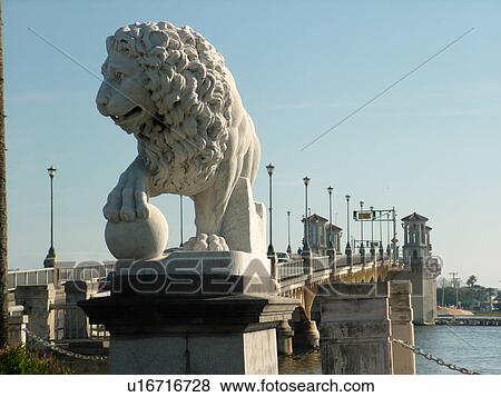 Stock Photo -  St. Augustine, FL, Florida, The Old City, Lion Statue guards The Bridge of Lions, Matanzas Bay. Fotosearch