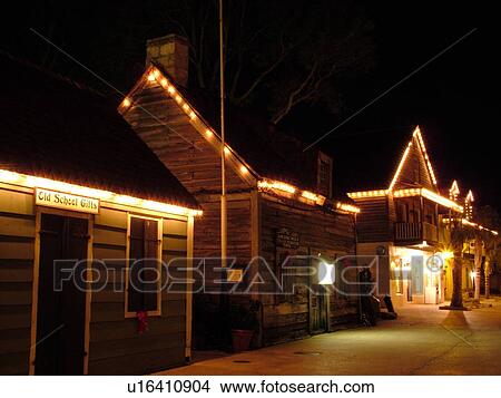 St. Augustine, FL, Florida, The Oldest Wooden Schoolhouse in The Old city, St. George Street decorated for the Christmas Holiday in the evenings, Walking Mall View Large Photo Image Picture - St. Augustine, FL, Florida, The Oldest Wooden Schoolhouse in The Old city, St. George Street decorated for the Christmas Holiday in the evenings, Walking Mall. Fotosearch