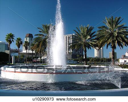 Stock Image -  St. Petersburg, FL, Florida, Tampa Bay, The Raymond James Bayside Fountain and Gardens. Fotosearch