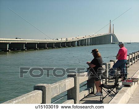 St. Petersburg, FL, Florida, Tampa Bay, Sunshine Skyway Bridge, I-275, 15 mile bridge spans lower Tampa Bay, couple fishing on the Skyway Fishing Pier View Large Photo Image Stock Photo - St. Petersburg, FL, Florida, Tampa Bay, Sunshine Skyway Bridge, I-275, 15 mile bridge spans lower Tampa Bay, couple fishing on the Skyway Fishing Pier. Fotosearch