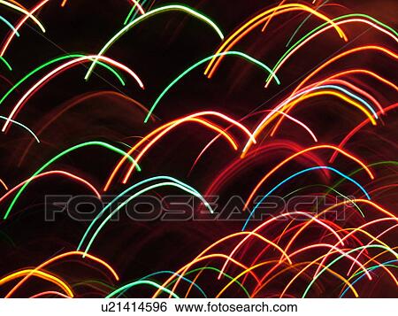 streaks of colorful lights on dark background View Large Photo Image Stock Photograph - streaks of colorful lights on dark background. Fotosearch