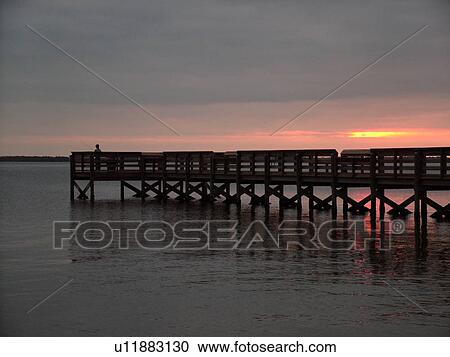 Stock Image -  Titusville, Merritt Island, FL, Florida, Indian River, fishing pier, sunrise, boardwalk. Fotosearch