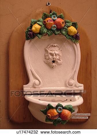 Tuscany, Italy, Cortona, Toscana, Europe, Ceramic pottery fountain on the wall of a building in downtown Cortona. View Large Photo Image Stock Image - Tuscany, Italy, Cortona, Toscana, Europe, Ceramic pottery fountain on the wall of a building in downtown Cortona.. Fotosearch