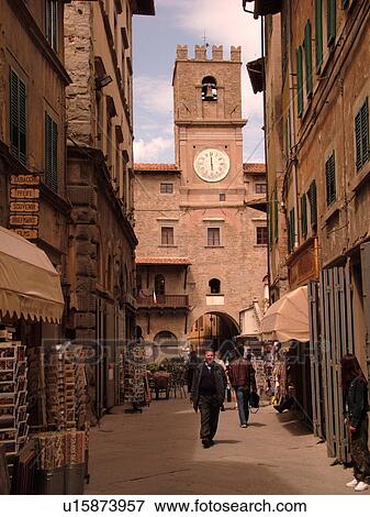 Tuscany, Italy, Cortona, Toscana, Europe, Shops along a narrow street near the Palazzo Comunale in the hill town Cortona. View Large Photo Image Stock Photo - Tuscany, Italy, Cortona, Toscana, Europe, Shops along a narrow street near the Palazzo Comunale in the hill town Cortona.. Fotosearch