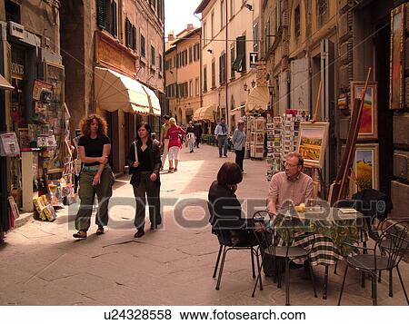 Tuscany, Italy, Cortona, Toscana, Europe, Outdoor cafT and shops along a narrow street in downtown Cortona. View Large Photo Image Stock Photo - Tuscany, Italy, Cortona, Toscana, Europe, Outdoor cafT and shops along a narrow street in downtown Cortona.. Fotosearch