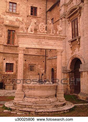 Stock Photograph -  Tuscany, Italy, Montepulciano, Toscana, Europe, Cistern in the Piazza Grande in the medieval town of Montepulciano.. Fotosearch