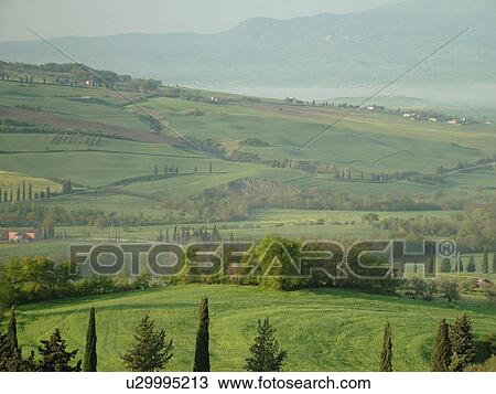 Stock Image -  Tuscany, Italy, Pienza, Toscana, Europe, Scenic countryside of Tuscany in the fog in Pienza.. Fotosearch