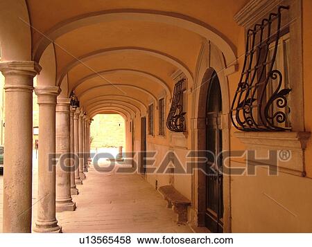 Stock Photo -  Tuscany, Italy, Poppi, Toscana, Europe, Arcades line the main street of downtown Poppi in the Casentino hill region.. Fotosearch