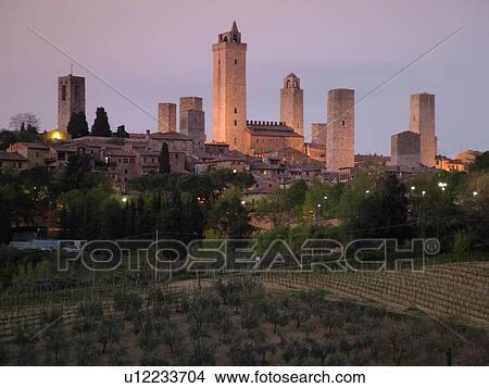 Tuscany, Italy, San Gimignano, Toscana, Europe, Scenic view of the medieval town of San Gimignano in the evening in the Chianti Region. View Large Photo Image Picture - Tuscany, Italy, San Gimignano, Toscana, Europe, Scenic view of the medieval town of San Gimignano in the evening in the Chianti Region.. Fotosearch