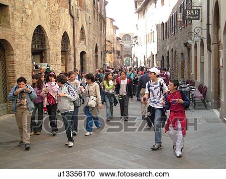 Tuscany, Italy, San Gimignano, Toscana, Europe, Group of students walking through the narrow streets of the medieval town of San Gimignano. View Large Photo Image Stock Image - Tuscany, Italy, San Gimignano, Toscana, Europe, Group of students walking through the narrow streets of the medieval town of San Gimignano.. Fotosearch