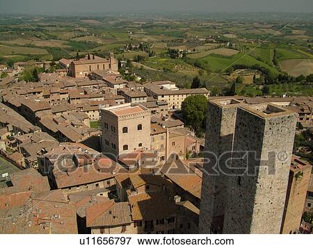 Tuscany, Italy, San Gimignano, Toscana, Europe, Aerial view of the rooftops and medieval town of San Gimignano from Torre Grossa. View Large Photo Image Stock Photo - Tuscany, Italy, San Gimignano, Toscana, Europe, Aerial view of the rooftops and medieval town of San Gimignano from Torre Grossa.. Fotosearch