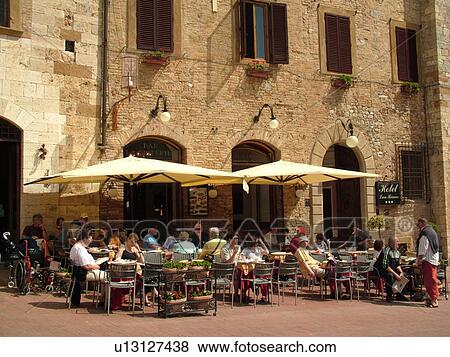 Tuscany, Italy, San Gimignano, Toscana, Europe, Outdoor cafT in the Piazza della Cisterna in the medieval town of San Gimignano. View Large Photo Image Stock Photo - Tuscany, Italy, San Gimignano, Toscana, Europe, Outdoor cafT in the Piazza della Cisterna in the medieval town of San Gimignano.. Fotosearch