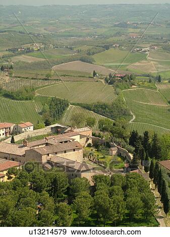 Tuscany, Italy, San Gimignano, Toscana, Europe, Aerial view of the rooftops and countryside of the medieval town of San Gimignano from Torre Grossa. View Large Photo Image Stock Photo - Tuscany, Italy, San Gimignano, Toscana, Europe, Aerial view of the rooftops and countryside of the medieval town of San Gimignano from Torre Grossa.. Fotosearch