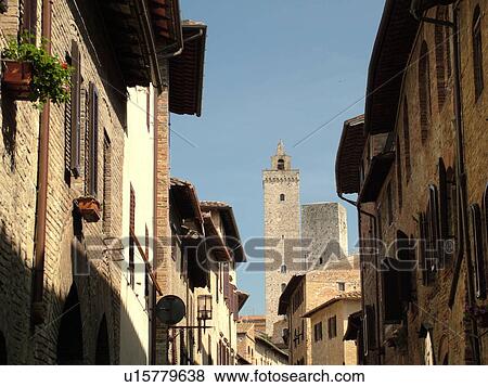 Stock Photo -  Tuscany, Italy, San Gimignano, Toscana, Europe, Buildings along Via San Gimignano in the medieval town of San Gimignano in the Chianti Region.. Fotosearch