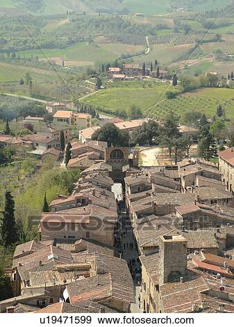 Tuscany, Italy, San Gimignano, Toscana, Europe, Aerial view of the rooftops and countryside of the medieval town of San Gimignano from Torre Grossa. View Large Photo Image Stock Photo - Tuscany, Italy, San Gimignano, Toscana, Europe, Aerial view of the rooftops and countryside of the medieval town of San Gimignano from Torre Grossa.. Fotosearch
