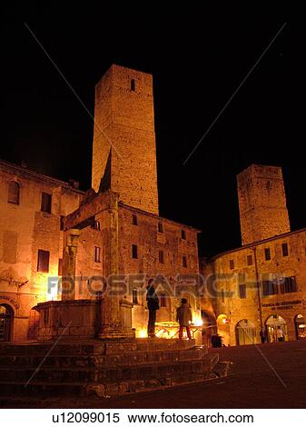 Stock Photography -  Tuscany, Italy, San Gimignano, Toscana, Europe, Piazza della Cisterna in the medieval town of San Gimignano in the evening.. Fotosearch