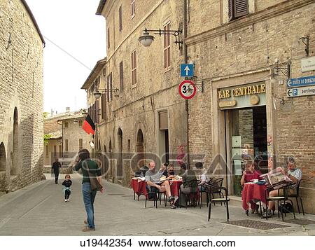 Picture -  Umbria, Italy, Bevagna, Europe, Outdoor cafT at Piazza Filippo Silvestre (Silvestri) in the medieval town of Bevagna.. Fotosearch