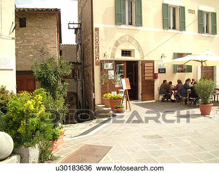 Umbria, Italy, Montefalco, Europe, Outdoor cafT at a wine shop in the piazza in downtown Montefalco. View Large Photo Image Stock Photograph - Umbria, Italy, Montefalco, Europe, Outdoor cafT at a wine shop in the piazza in downtown Montefalco.. Fotosearch