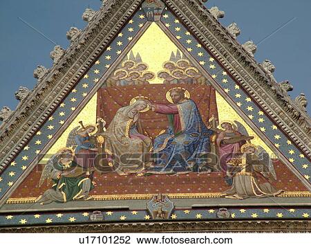 Stock Image -  Umbria, Italy, Orvieto, Europe, Colorful mosaic and sculpture on the fatade of The Cathedral in the medieval town of Orvieto.. Fotosearch