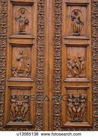 Stock Photo -  Umbria, Italy, Spello, Europe. Fatade of the wooden door of the Chiesa di Santa Maria Maggiore in the medieval town of Spello.. Fotosearch