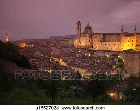 Stock Photo -  Urbino, Marche, Italy, Europe, Scenic view of the medieval hill town of Urbino in the evening.. Fotosearch