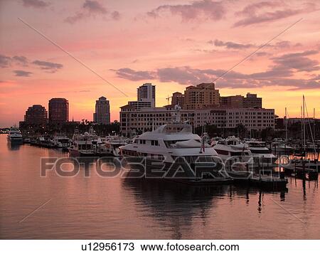 Stock Image -  West Palm Beach, FL, Florida, Lake Worth, skyline, marina, sunset. Fotosearch