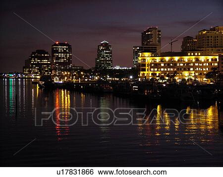Stock Photograph -  West Palm Beach, FL, Florida, Lake Worth, marina, skyline, evening. Fotosearch