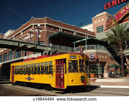 Picture -  Ybor City, FL, Florida, Tampa, Tampa Bay, Hillsborough Area Regional Transit, Tampa Bay Streetcar System, Teco Line, yellow streetcar. Fotosearch