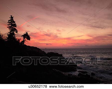Stock Photo -  Acadia National Park, ME, Maine, Atlantic Ocean, Mount Desert Island, Otter Point, scenic coastline, sunrise. Fotosearch