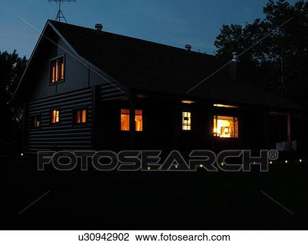 Stock Image -  Alexandria, MN, Minnesota, Maple Lake, log cabin, home, evening. Fotosearch