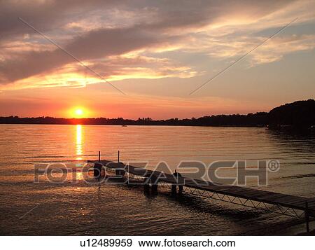 Stock Photo -  Alexandria, MN, Minnesota, Maple Lake, sunset. Fotosearch