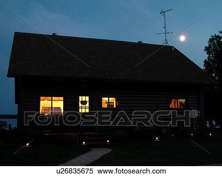 Stock Photography -  Alexandria, MN, Minnesota, Maple Lake, log cabin, home, evening. Fotosearch