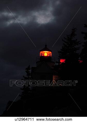 Stock Image -  Bass Harbor, Acadia National Park, ME, Maine, Atlantic Ocean, Mount Desert Island, Bass Harbor Head Lighthouse, evening. Fotosearch