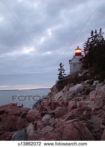 Stock Image -  Bass Harbor, Acadia National Park, ME, Maine, Atlantic Ocean, Mount Desert Island, Bass Harbor Head Lighthouse, sunset. Fotosearch