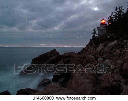 Stock Image -  Bass Harbor, Acadia National Park, ME, Maine, Atlantic Ocean, Mount Desert Island, Bass Harbor Head Lighthouse, evening. Fotosearch