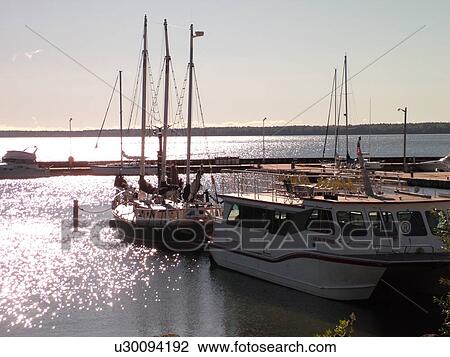 Stock Image -  Bayfield, WI, Wisconsin, Lake Superior, marina, harbor, sailboat. Fotosearch