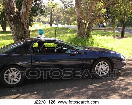 Big Island, Island of Hawaii, HI, Hawaii, Waimea, policeman in car checking speed with radar View Large Photo Image Stock Photograph - Big Island, Island of Hawaii, HI, Hawaii, Waimea, policeman in car checking speed with radar. Fotosearch