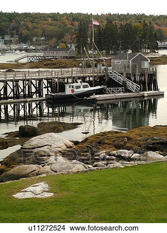 Picture -  Booth Bay Harbor, ME, Maine, fishing village, boats, low tide, docks. Fotosearch