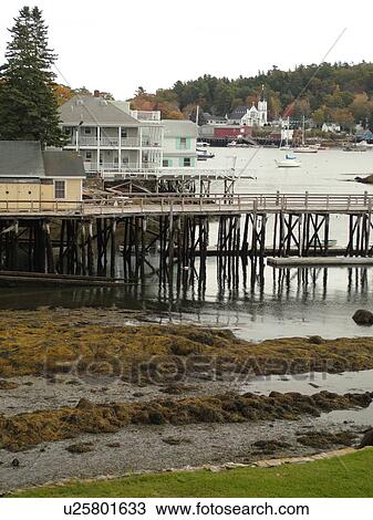 Stock Image -  Booth Bay Harbor, ME, Maine, fishing village, boats, low tide, docks. Fotosearch