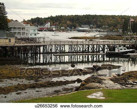 Stock Photograph -  Booth Bay Harbor, ME, Maine, fishing village, boats, low tide, docks. Fotosearch