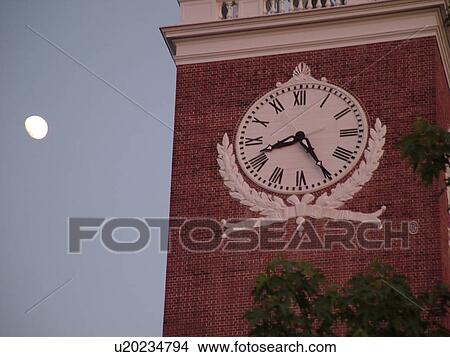 Picture -  Burlington, VT, Vermont, Ira Allen Chapel, steeple, clock tower, moonrise, evening. Fotosearch