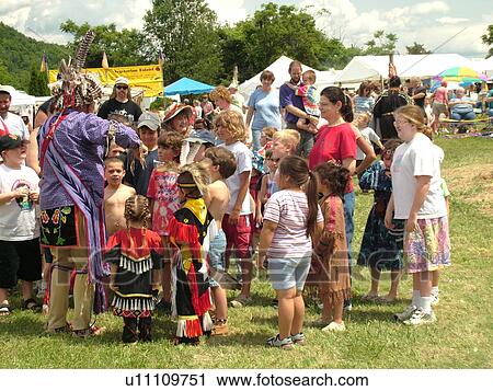 Stock Image -  Charlotte, VT, Vermont, Intertribal Pow-Wow, ceremony, tribal gathering, children gather around the story teller. Fotosearch