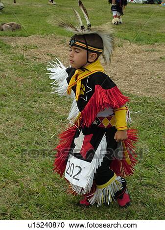 Stock Image -  Charlotte, VT, Vermont, Intertribal Pow-Wow, ceremony, tribal gathering, young boy dancing. Fotosearch