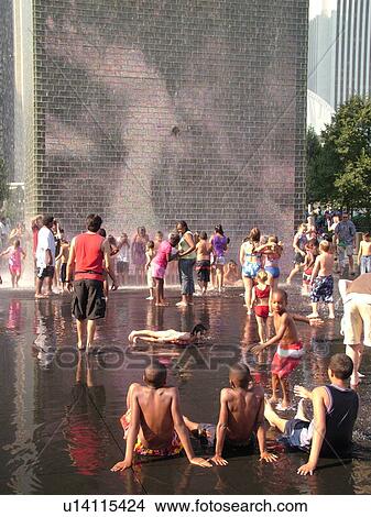 Chicago, IL, Illinois, Windy City, Downtown, Millennium Park, Crown Fountain, people cooling off, hot summer day View Large Photo Image Picture - Chicago, IL, Illinois, Windy City, Downtown, Millennium Park, Crown Fountain, people cooling off, hot summer day. Fotosearch