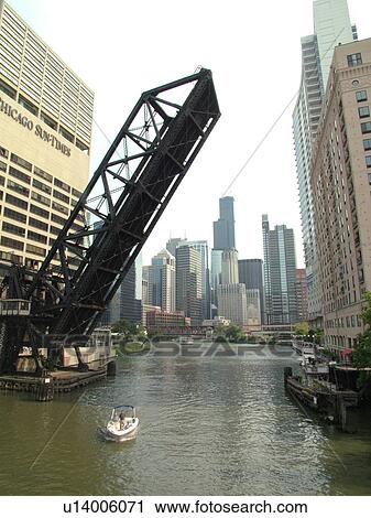 Stock Image -  Chicago, IL, Illinois, Windy City, Downtown, skyline, North Branch Chicago River, railroad drawbridge raised. Fotosearch