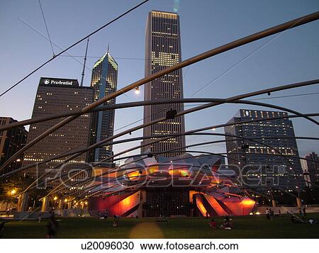 Chicago, IL, Illinois, Windy City, Downtown, skyline, Millennium Park, Jay Pritzker Pavilion, designed by Frank Gehry, Great Lawn, evening View Large Photo Image Stock Image - Chicago, IL, Illinois, Windy City, Downtown, skyline, Millennium Park, Jay Pritzker Pavilion, designed by Frank Gehry, Great Lawn, evening. Fotosearch