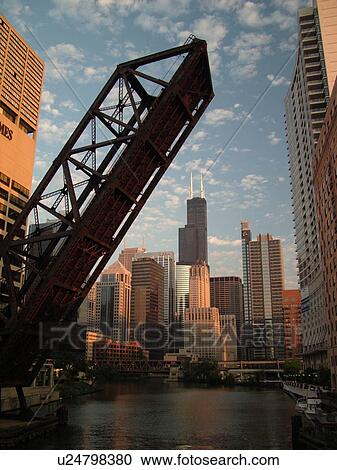 Stock Image -  Chicago, IL, Illinois, Windy City, Downtown, skyline, North Branch Chicago River, railroad drawbridge raised. Fotosearch
