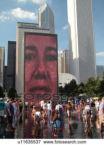 Chicago, IL, Illinois, Windy City, Downtown, Millennium Park, Crown Fountain, people cooling off, hot summer day, face, video image on wall, mural View Large Photo Image Stock Photo - Chicago, IL, Illinois, Windy City, Downtown, Millennium Park, Crown Fountain, people cooling off, hot summer day, face, video image on wall, mural. Fotosearch